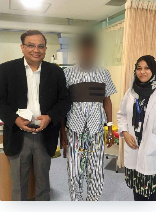 Dr. Binayak Chanda with a patient and colleague